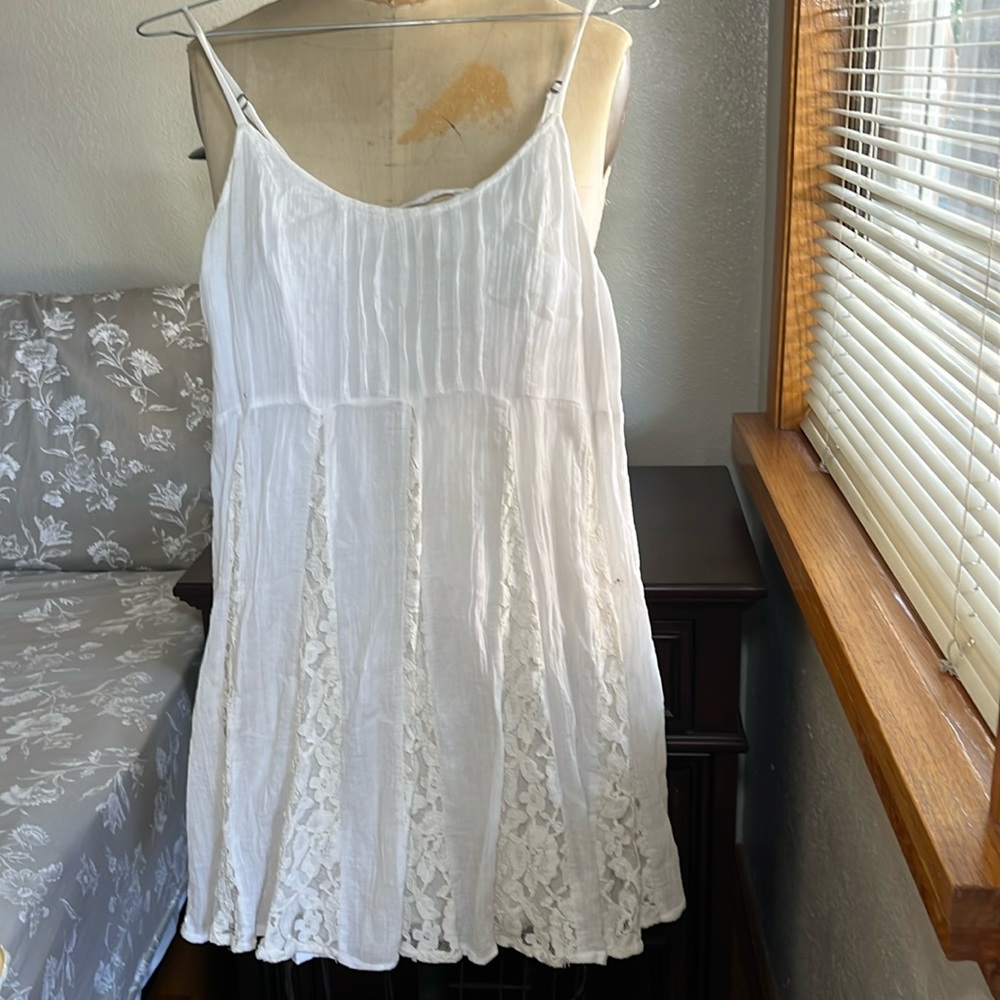 White dress with lace details and lace up back